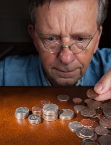 Senior man counting money