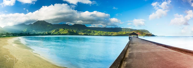 Widescreen panorama of Hanalei Bay and Pier on Kauai Hawaii