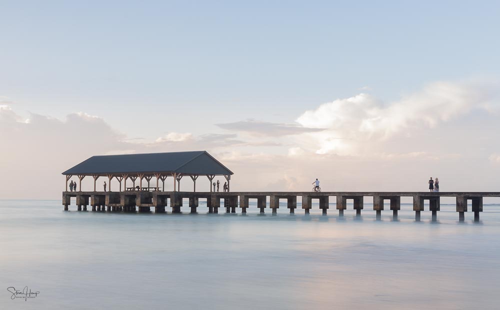 Long exposure blurred motion image of dawn over Hanalei pier in Kauai